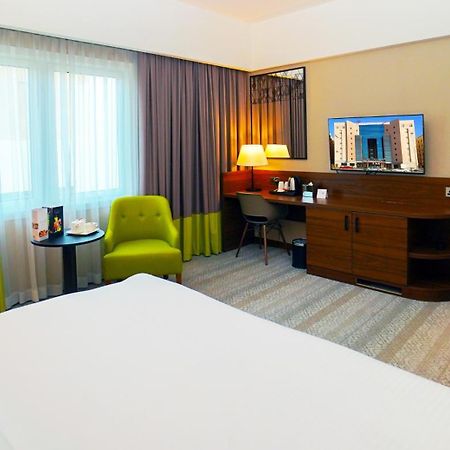 The Grand Lux Hotel Doha Exteriör bild A room at the hotel