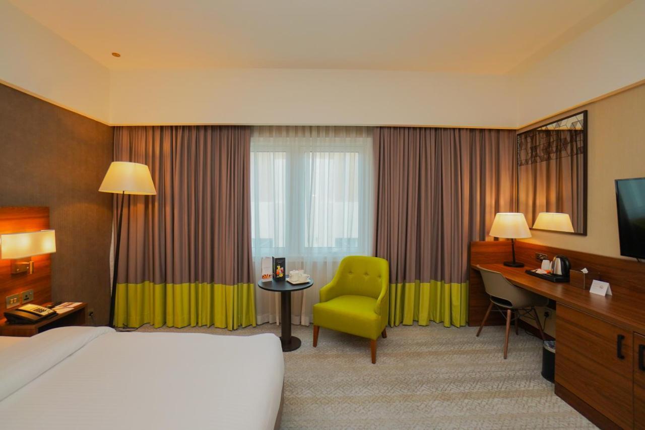 The Grand Lux Hotel Doha Exteriör bild A room at the hotel