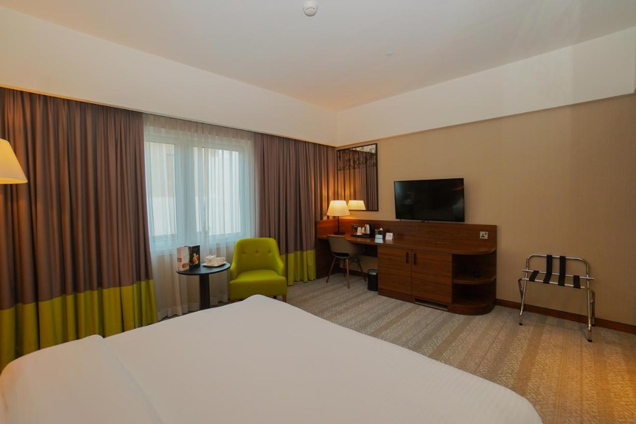 The Grand Lux Hotel Doha Exteriör bild A room at the hotel