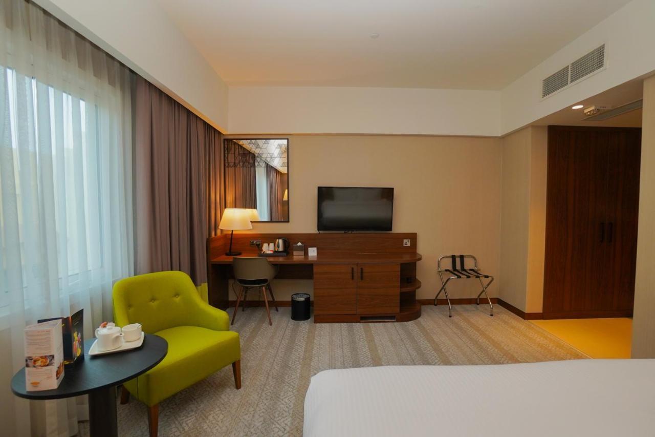 The Grand Lux Hotel Doha Exteriör bild A room at the hotel