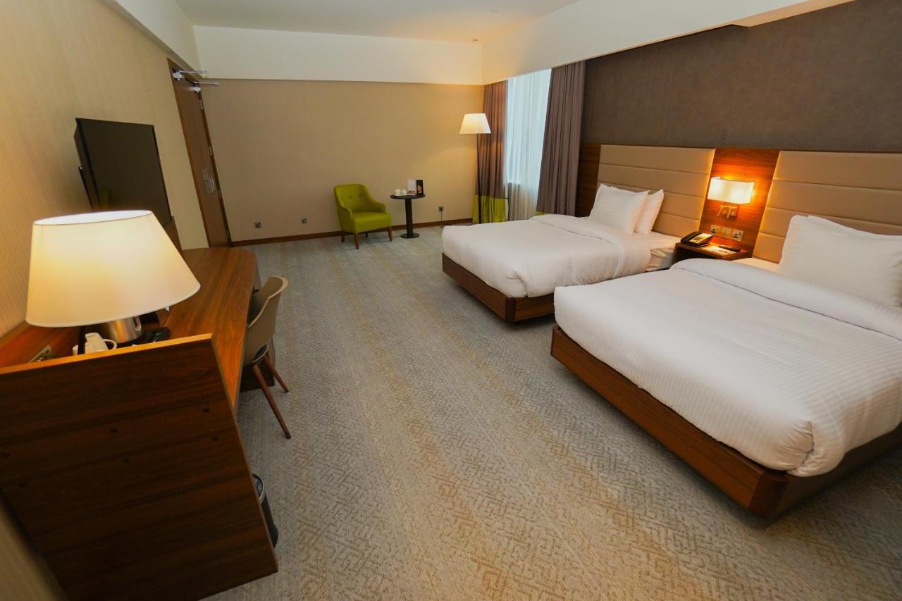 The Grand Lux Hotel Doha Exteriör bild A room at the hotel