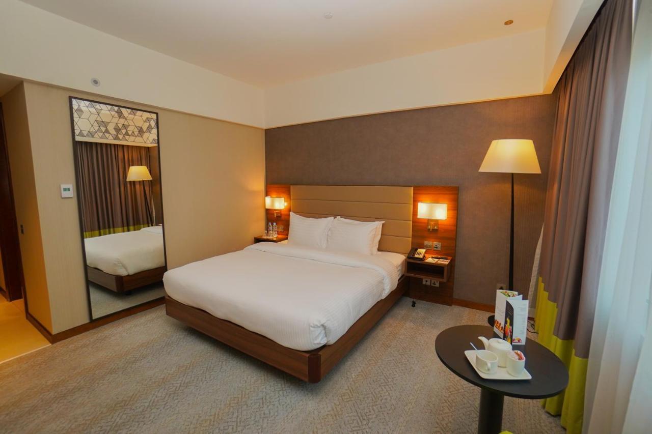 The Grand Lux Hotel Doha Exteriör bild A room at the hotel