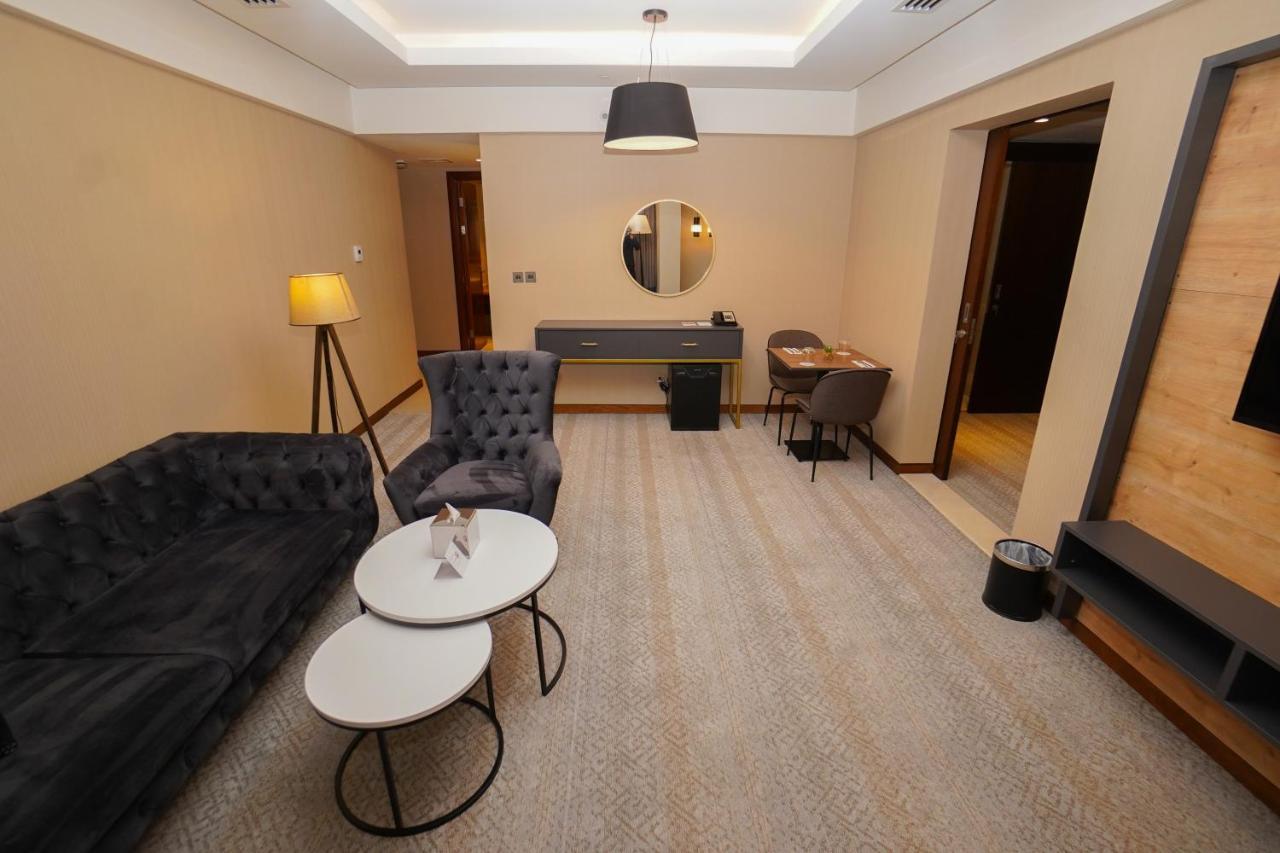 The Grand Lux Hotel Doha Exteriör bild A suite at the hotel