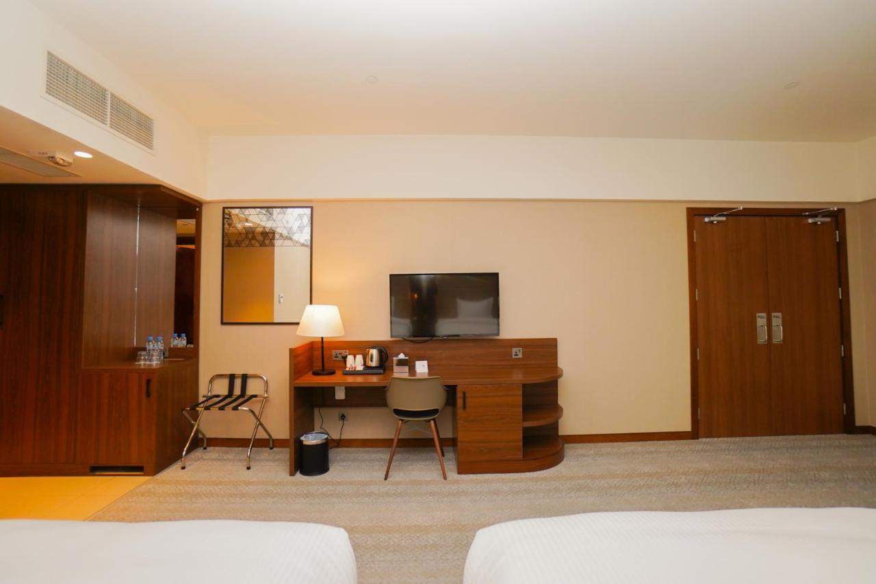 The Grand Lux Hotel Doha Exteriör bild A room at the hotel