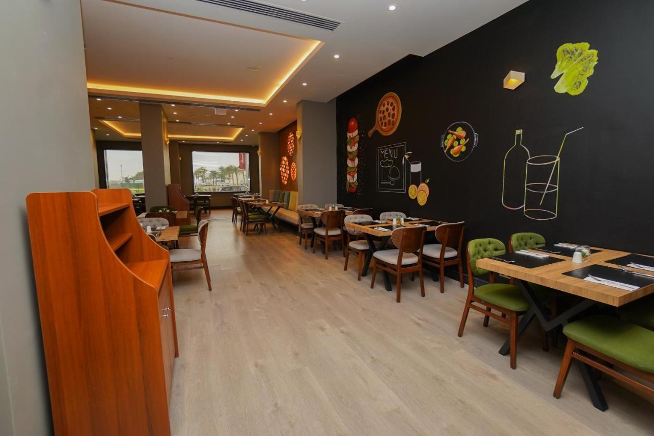 The Grand Lux Hotel Doha Exteriör bild Interior of a restaurant in Cairo, Egypt