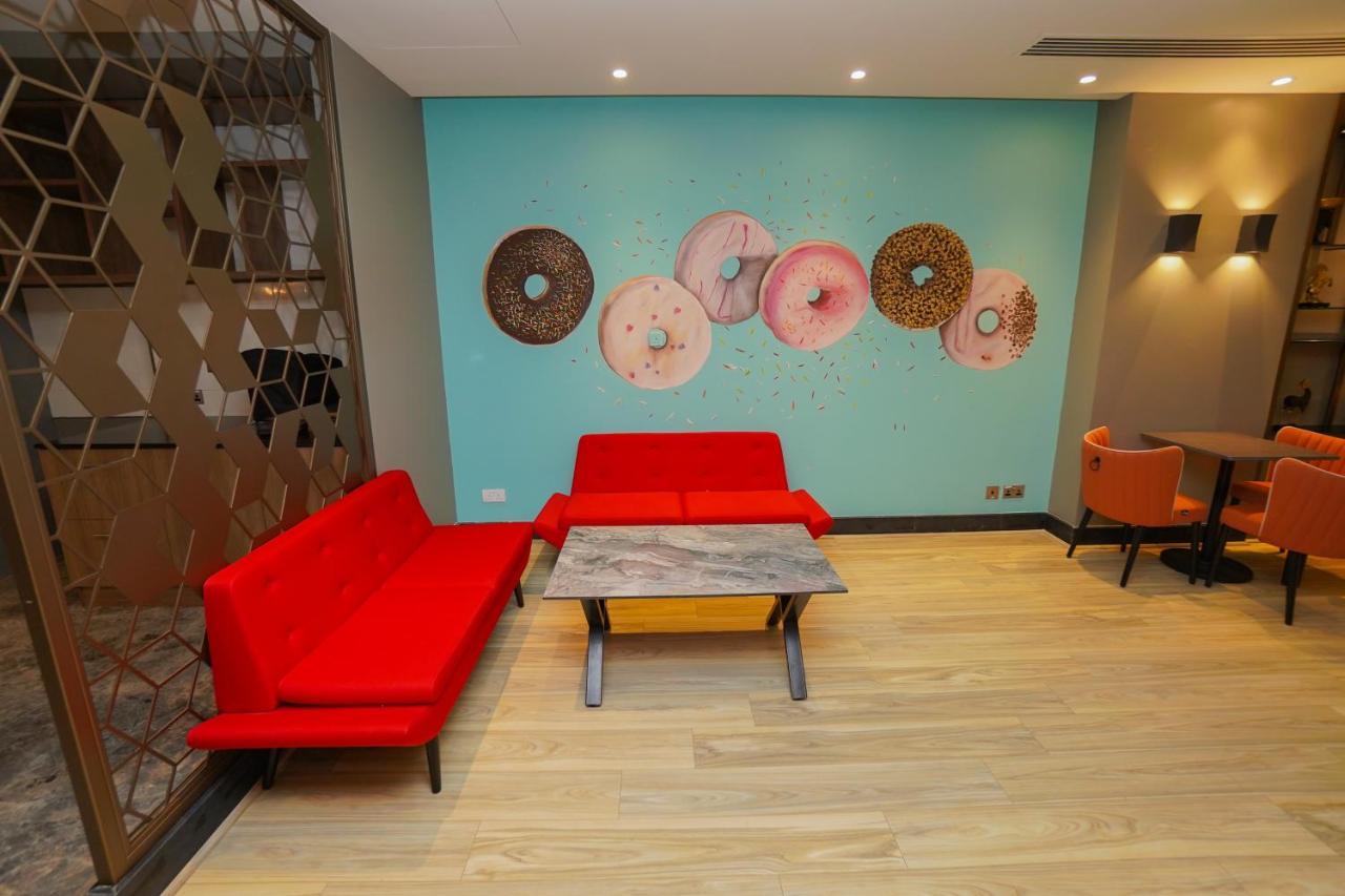 The Grand Lux Hotel Doha Exteriör bild The interior of a Dunkin' Donuts in Paris, France