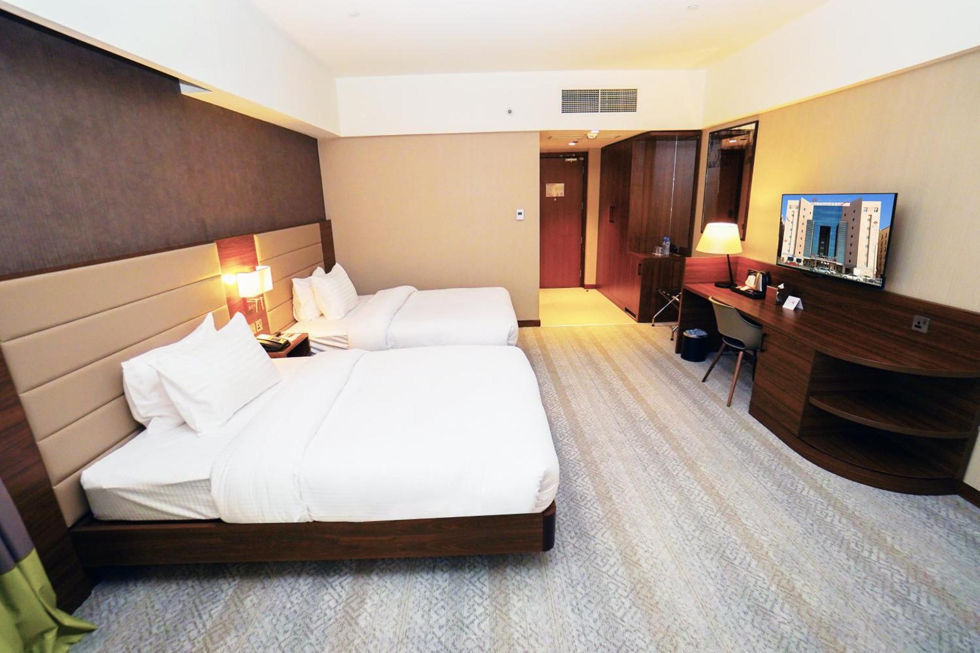 The Grand Lux Hotel Doha Exteriör bild Deluxe Room